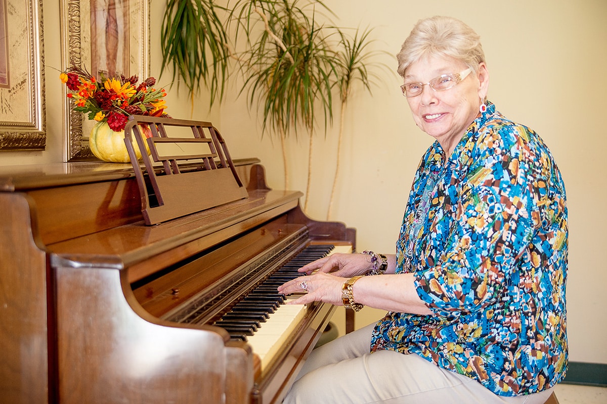 A resident playing the piano at Richwood Nursing & Rehab