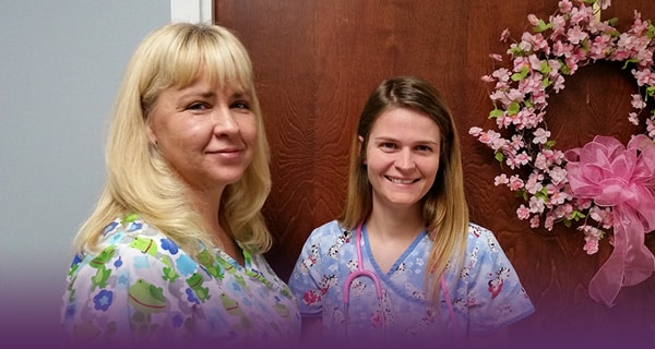 Two nurses in the hallway of Richwood Nursing & Rehab